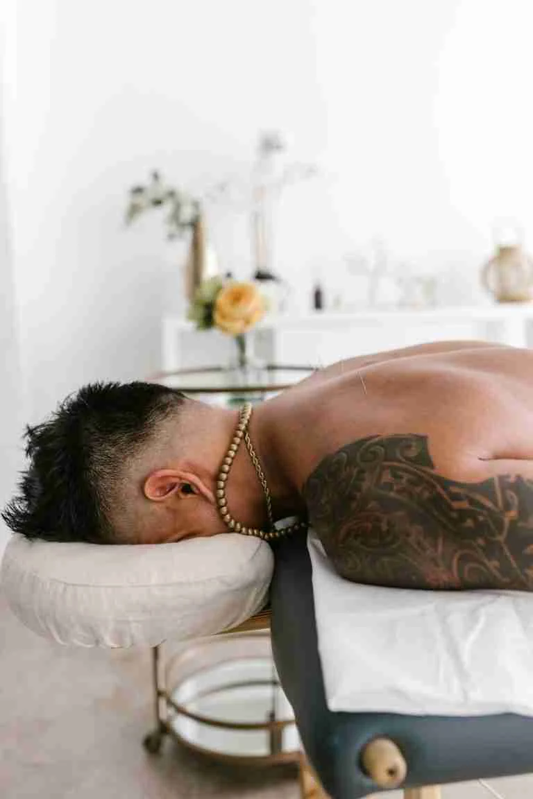 Male client receiving a relaxing back wax in Charlotte NC